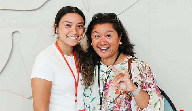 A Fairfield parent posing with her daughter, excited to participate in Orientation activities.