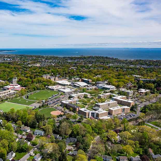 Aerial photo of Fairfield University campus with Long Island sound in the distance.