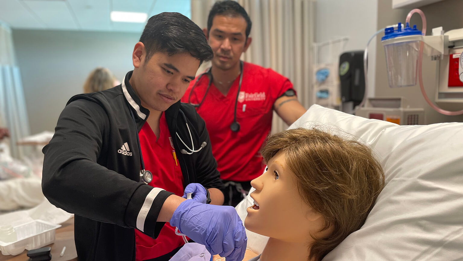 Image of nursing students in hospital like setting.