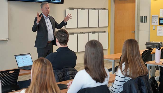 Image of Connecticut Governor Ned Lamont visiting business analytics classroom