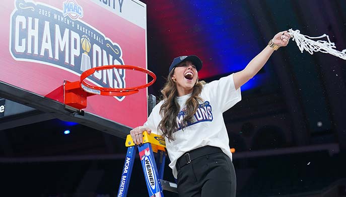 Image of a joyful Coach Carly holds a basketball net high, celebrating a victory with enthusiasm