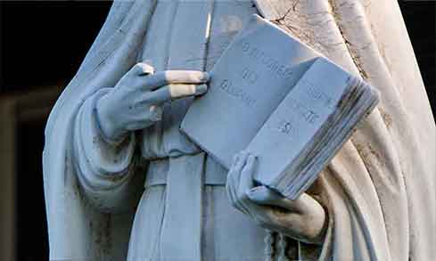 White statue of St. Ignatius.