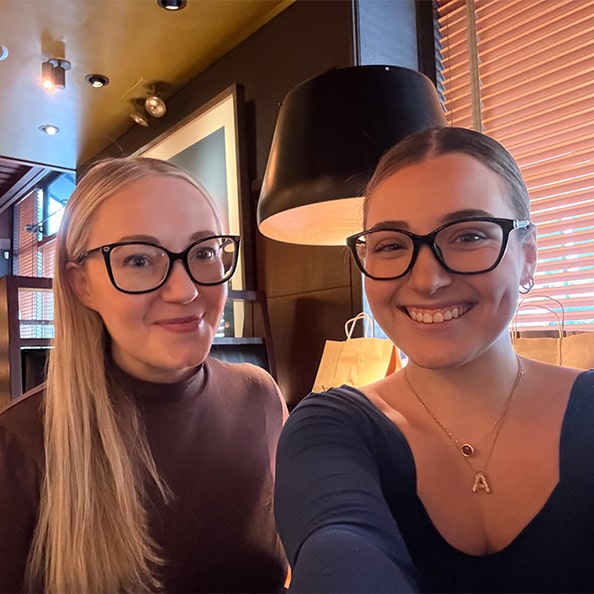 Fairfield University senior taking an excited selfie with her job shadow mentor.