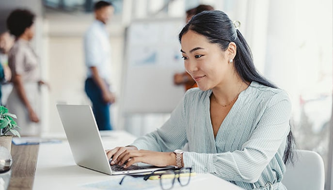 A business analyst works on compiling data for a project.