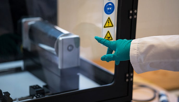 guy pointing at a machine