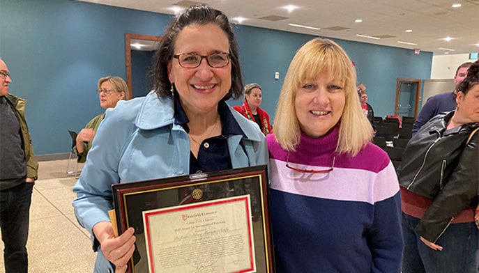 Silvia Marsans-Sakly, PhD, and Patricia Behre, PhD, at the College of Arts and Sciences Faculty and Staff Awards Ceremony.