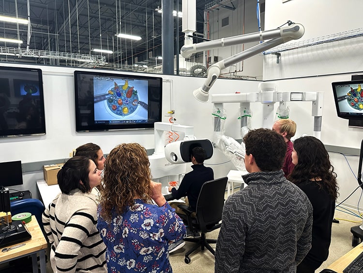Students interfacing with a state-of-the-art integrated robotic surgery system.